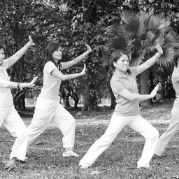 Tai chi for Parkinson's is demonstrated by women in park