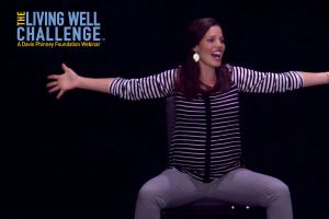Physical Therapist demonstrates seated stretches to improve posture and voice