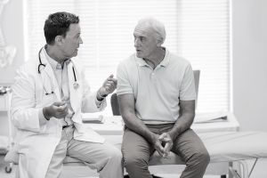 Man and doctor discuss impulse control disorders and Parkinson's