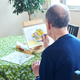Person painting at table