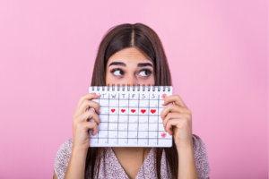 woman holding menstruation calendar
