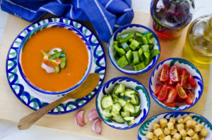 Gazpacho, cucumbers, peppers, tomatoes on a table