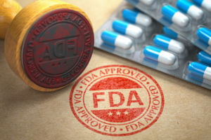 Rubber stamp with FDA and pills on craft paper