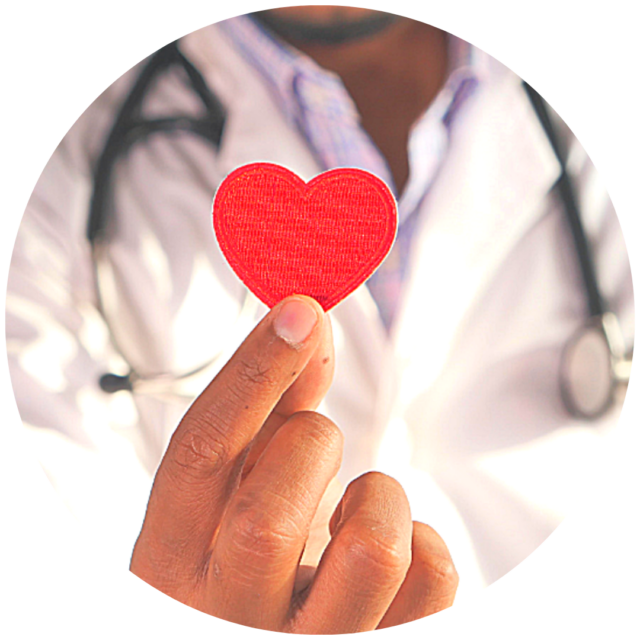 Close up of doctor holding paper heart