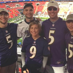 Family of five at football arena