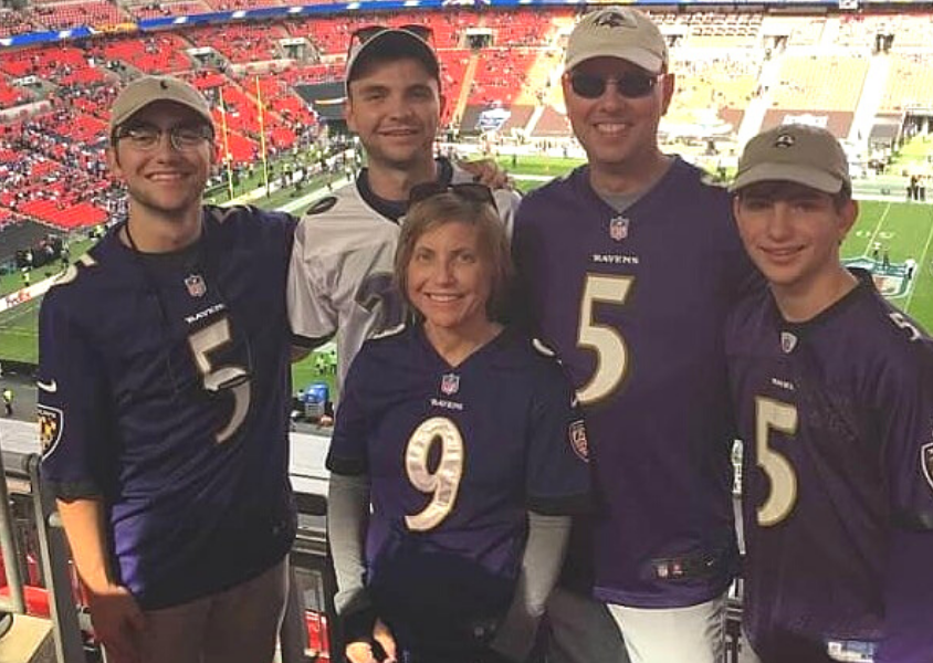 Family of five at football arena