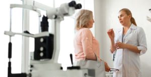 ophthalmologist actively gesturing while talking with patient