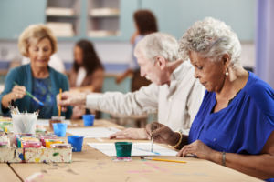 Adults taking art class at community center