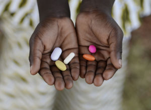Close-up of hands Holding Colorful Pills