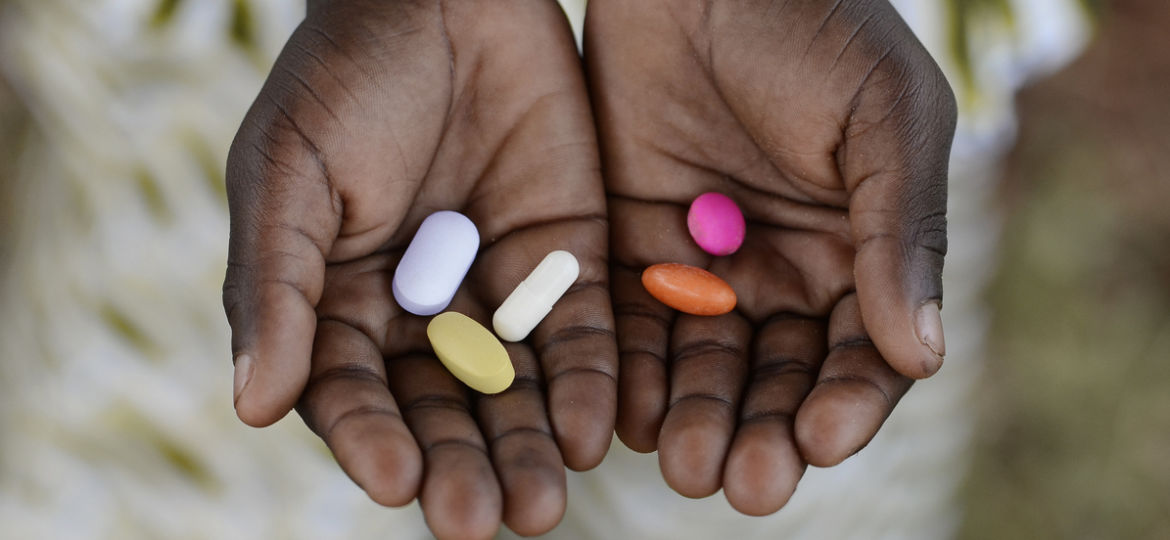 Close-up of hands Holding Colorful Pills