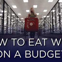 There is a picture of Jessica Schroeder, a blonde, white woman walking through the Target Freezer section, as shown by her red Target shopping cart. There is a faded blue bar at the bottom that says "How to Eat Well on a Budget". She is helping people live well with Parkinson's.