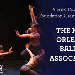 NOBA and Parkinson's - Davis Phinney Foundation New Orleans Ballet Association dancers on a black backdrop and stage. Their arms are up. The davis phinney foundation logo is on the left side of the page.