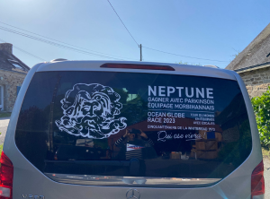 a minivan with the neptune logo on it.