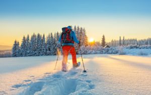 Snowshoer exercising in early morning